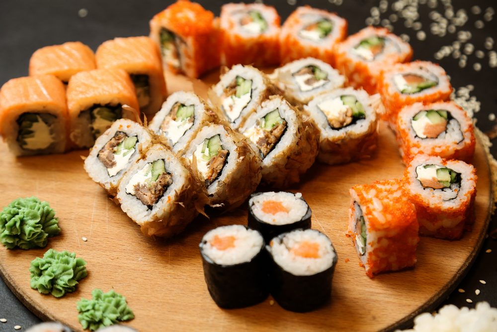 sushi set with tuna salmon vegetables ginger wasabi side view