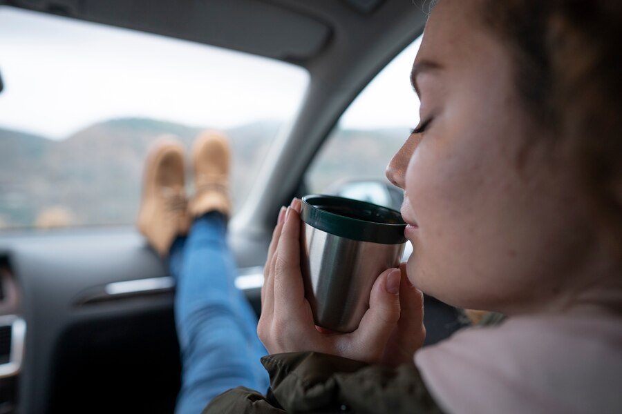 side view woman holding drink 23 2149437581