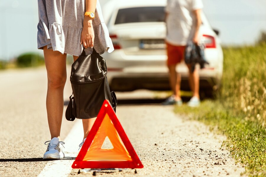 young couple broke down car while traveling way rest they are trying stop other drivers ask help hitchhike relationship troubles road vacation 155003 18340