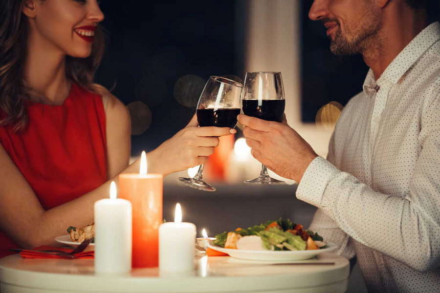 couple lovers having romantic dinner home