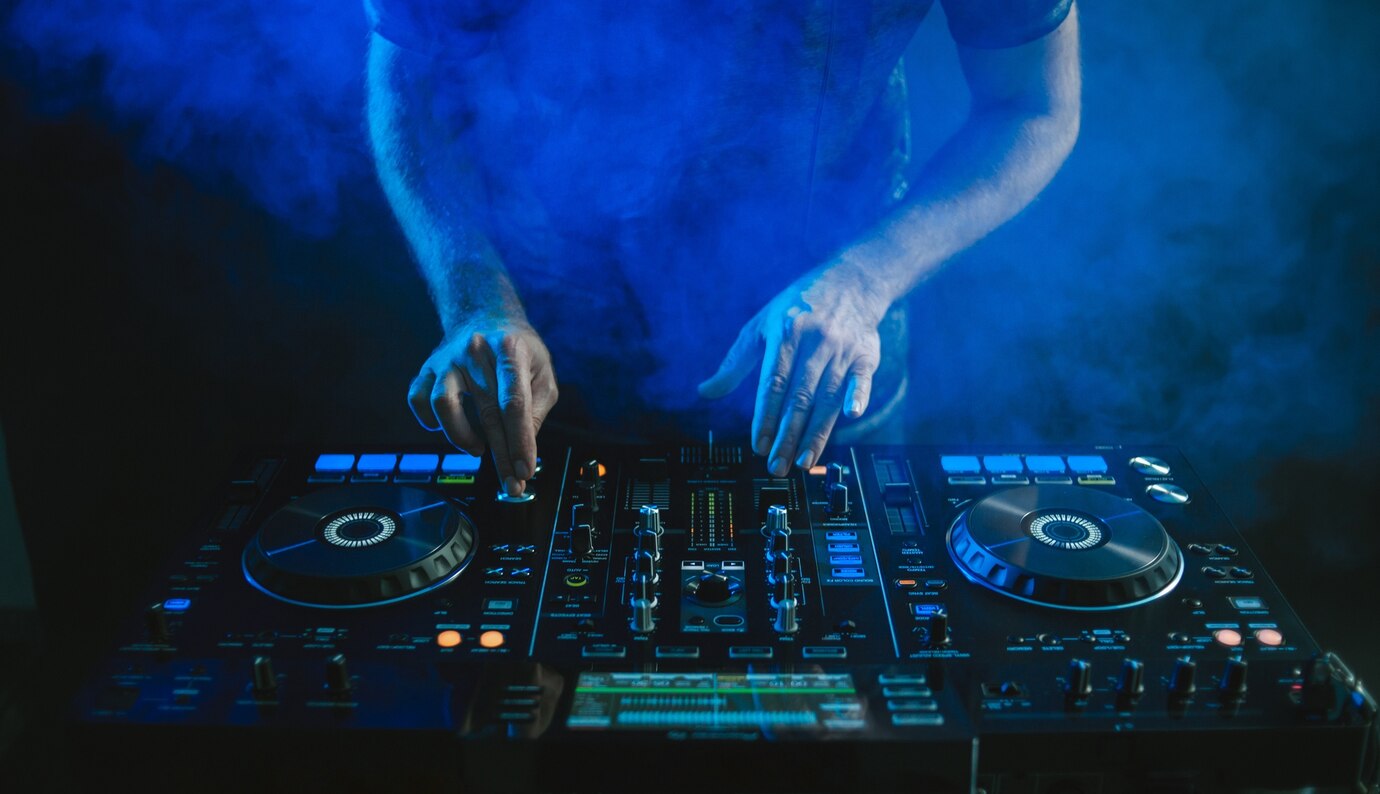 closeup dj working blue light 181624 18773