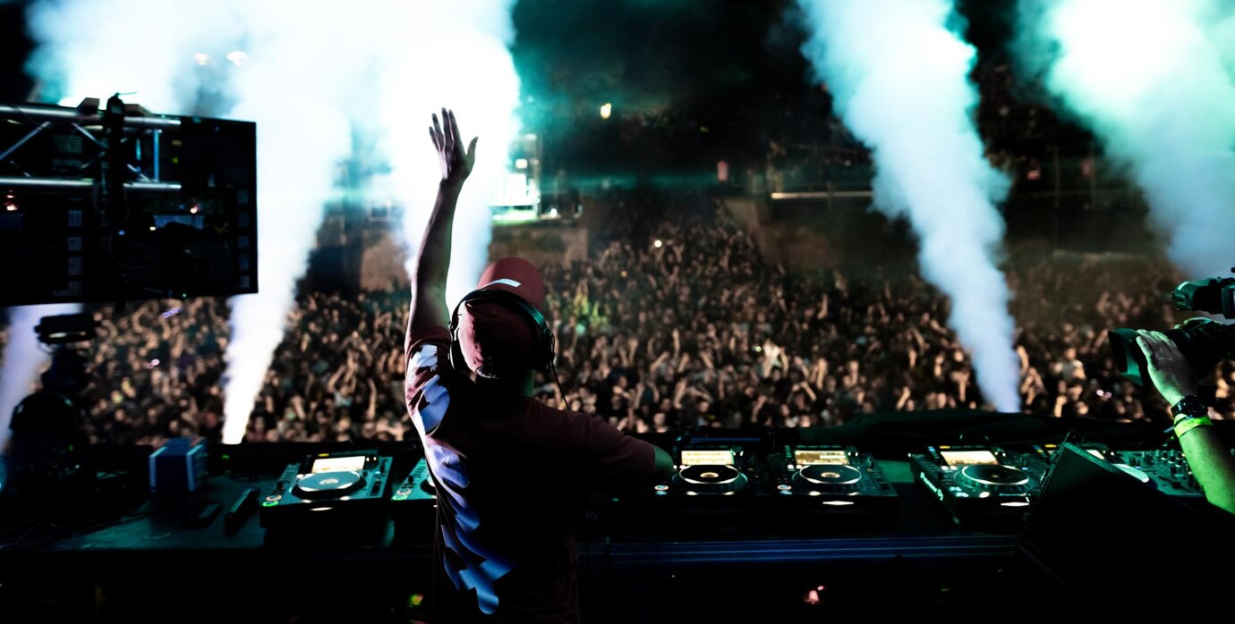 rear view dj playing music front excited crowd music festival by night 637285 598