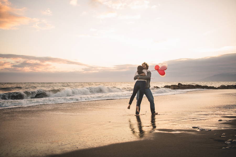 man turning his girlfriend herself air